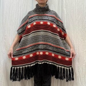 Black and Red Patterned Knit Turtleneck Poncho with Tassels